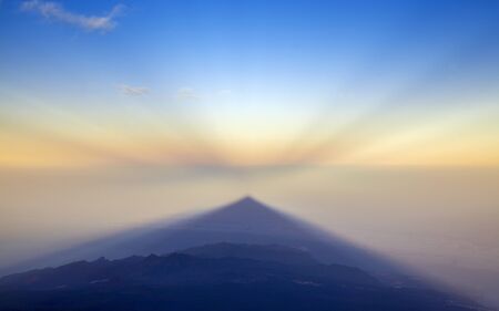 Sunrise on Teide, the tallest mountain of Spain and Atlantic Basin, view west towards  shadow of...
