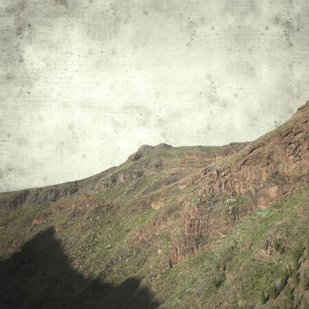textured stylish old paper background, square, with landscapes of Gran Canaria の写真素材