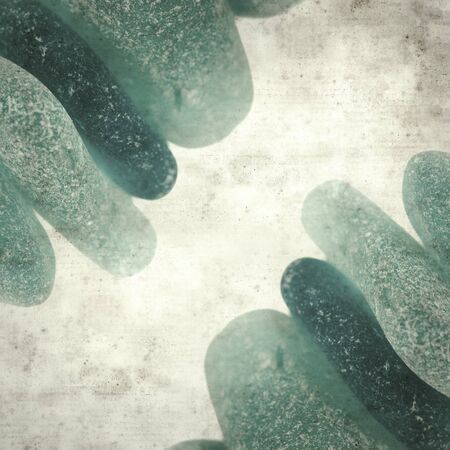 textured stylish old paper background, square, with sea glass pyramid