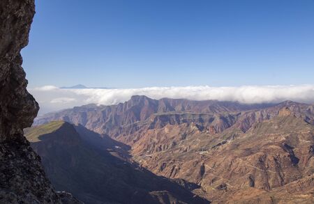 Gran Canaria, January, view from stone arch Ventana del Bentayga towards Teide on Tenerife