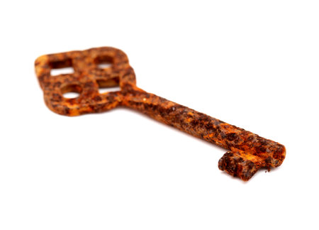 Old very rusty key isolated on white backgroundの写真素材