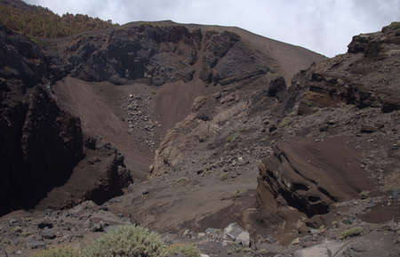 La Palma, long-range popular hiking route Ruta de Los Volcanes, landscapes around 
black crater of Hoyo Negro, i.e Black Hole, formed in 1949の写真素材
