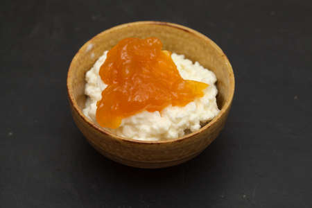 simple still life with cottage cheese in a ceramic bowlの写真素材