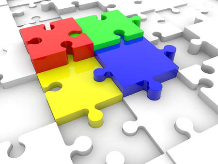 Four colored puzzle pieces between white puzzle piecesの写真素材