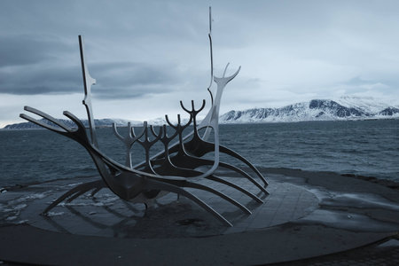 Sunset in Iceland with the skeleton of a wooden boatの写真素材