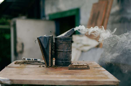 A beekeeper prepares a hive for honey production. Beekeeper is preparing for work.