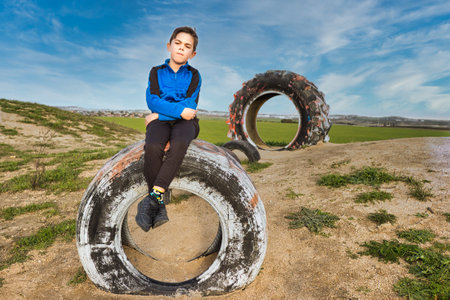 child on a tractor wheel