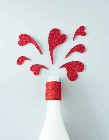 Hearts coming out of champagne. Minimal Flat lay compositionの写真素材