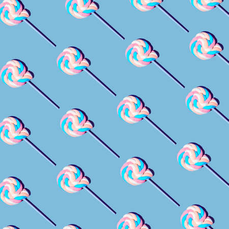 A pattern of colorful sweet lollipops. Gray background. Minimal composition.