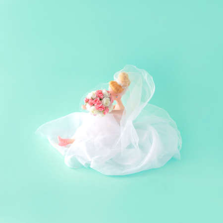 Bride with Biedermeier. Wedding day. A special day. Blue background. Minimal composition.の写真素材