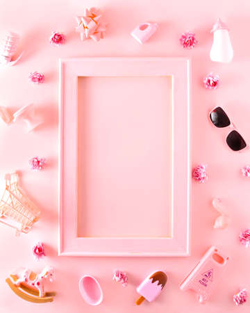 Wooden frame in nude pink with space for text with tiny pink things to buy. Aesthetics on nude backgrounds.の写真素材