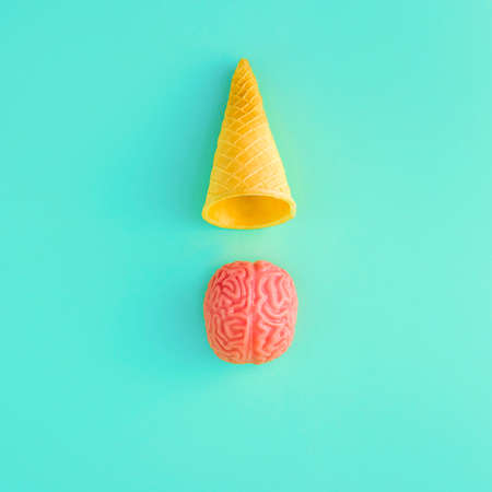 Brain ice cream with ice cream cone on pastel green background. Summer and Holidays minimalism.の写真素材