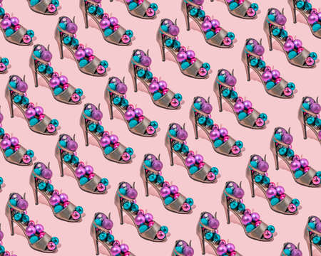 Pattern Creative ideas for Christmas decorations in women's shoes. Minimal trendy idea on a pink background.の写真素材