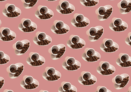Pattern of cups filled with coffee beans, on the side, some twisted, set diagonally, on pink background.の写真素材