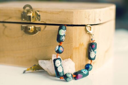 Wooden box, mineral stone and bijou, colorful photo.の写真素材