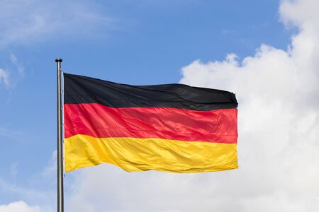 Germany flag on the sky backgroundの写真素材