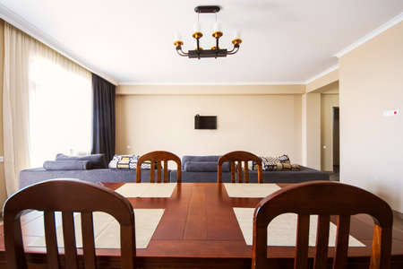 Living room interior. table, sofa, furniture and windows. Tv and stairs in Tbilisi, Georgia.のeditorial素材