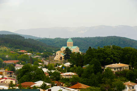 KUTAISI, GEORGIA - MAY 07, 2018: Gergeti church in Kutaisi, city view of old buildings and...