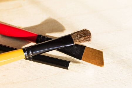 Paint brushes set, close-up. Marketing photo. white background, Studio shot.On the table.の写真素材