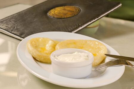 Potatoes dumpling with souse on the plate , ready to eat. Menu background.