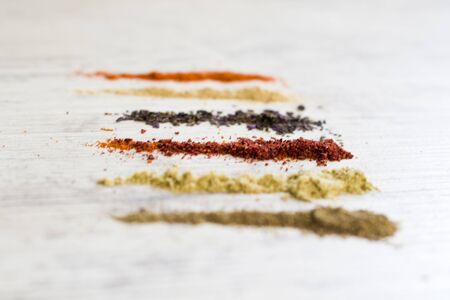 Spaces on the table, red and black pepperの写真素材