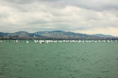 ISTANBUL, TURKEY - FEBRUARY 13, 2015: Istanbul cityscape and Bosporus channel, birds, landmarks and old city, boats and cloudy sky.の写真素材