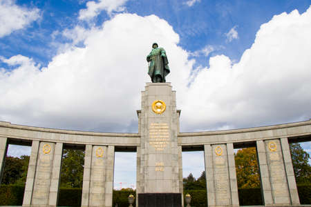 The Soviet War Memorial at Tiergarten in Berlin, Germany. Famous memorial, must visit place. Blue sky background.のeditorial素材