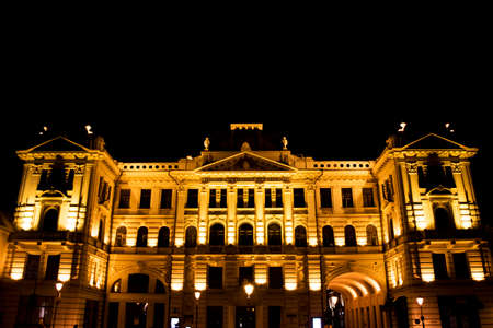 VILNIUS, LITHUANIA - OCTOBER 17, 2017: Grand Hotel Kempinski in city center at night, yellow lightsのeditorial素材