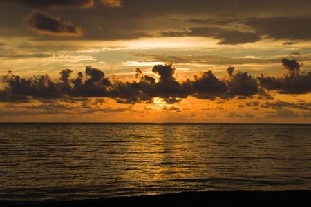 Seascape of the sunset on the Black sea, sunset time and colors, multicolored, orange,red,yellow,blue and purple,shadows and light.の写真素材