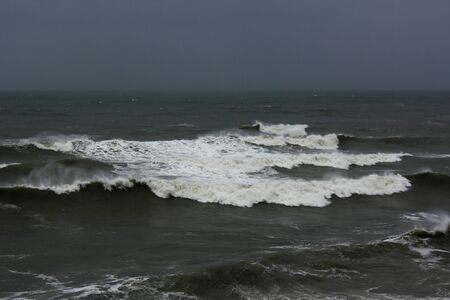 Stormy seascape, waves and wind in the black sea of Georgia. Drops ans splashes.