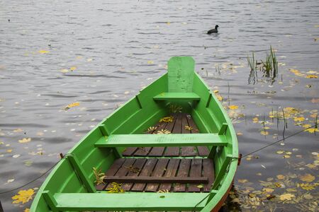 Old wooden boats near the beach of Trakai Gavle lake , Lithuania. Autumn and fall time.の写真素材