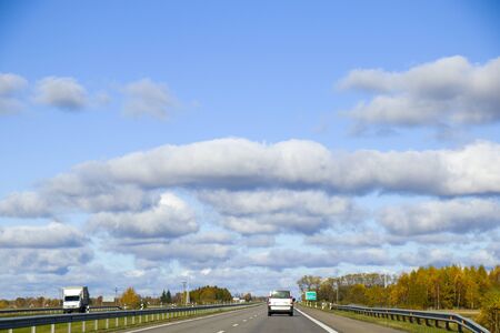 Highway, autobahn and road landscape. Automobile, cars and vehicles. Blue sky and sunny day. European autobahn. Nature and urban together.の写真素材
