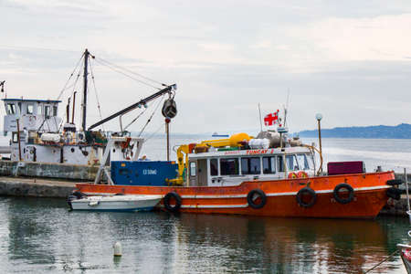 BATUMI, GEORGIA - JULY 08, 2020 - Port of Batumi, boats in harbor. Colorful boats in the Black sea.
