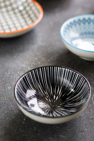 Colorful bowls on the black background, studio shootの写真素材