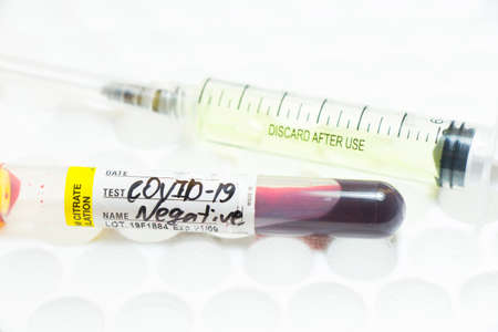 Medical needle and blood tube, corona virus or covid-19 vaccine. Close-up and studio shoot.