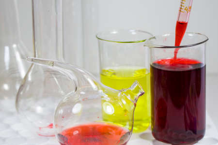 Laboratory chemical liquid elements and research diagnoses, instruments and objects in the sterile table, glassware and pipette. Studio shoot.の写真素材