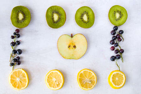 Currant, Cornus and dogberry, lemon and kiwi close-up, food photographyの写真素材