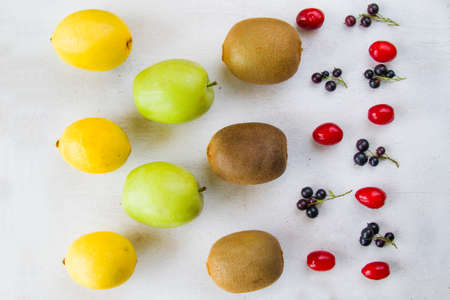 Currant, Cornus and dogberry, lemon and kiwi close-up, food photography