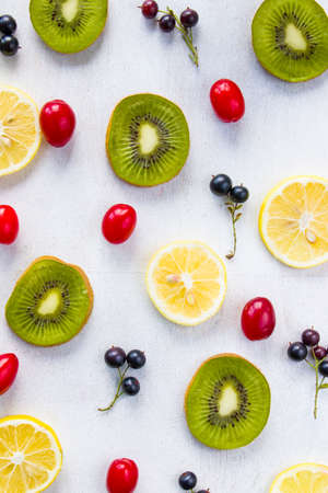 Currant, Cornus and dogberry, lemon and kiwi close-up, food photographyの写真素材