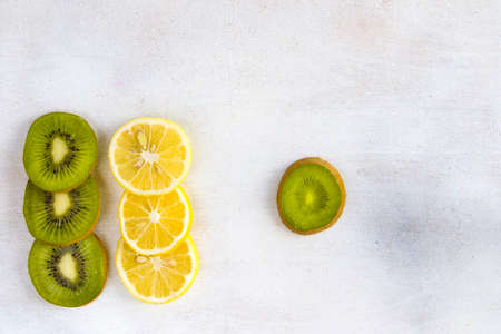 Lemon, and kiwi on the white background, high angle view