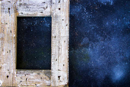 Empty frame on the blue background, space for textの写真素材