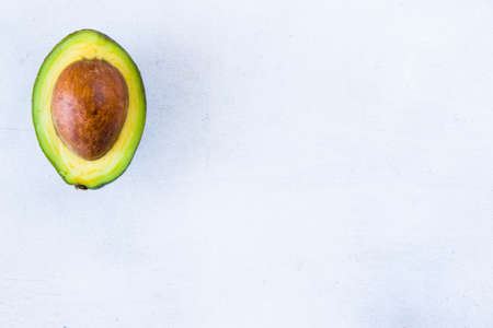 Half avocado on the white backgroundの写真素材