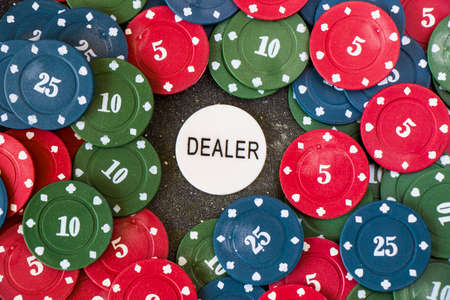 Card dealer chips on the poker and blackjack table, play cards