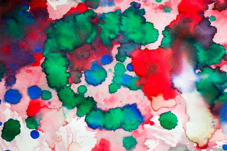 Ink drops on the paper, red, green and blue ink splashes background, painting and drawingの写真素材