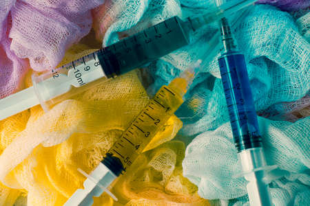 Watercolor cotton clothe and needle with colored water and colored bandage background and backdropの写真素材