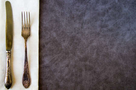 Tableware and dishware setting, folk and knife on the white and gray backgroundの写真素材