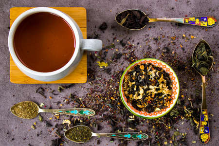 Herbal and natural dry tea set, variation and collection of tea and vintage spoons, cup of tea