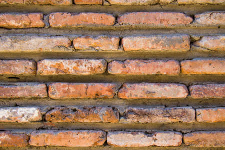 Wall background close-up, red stone wall