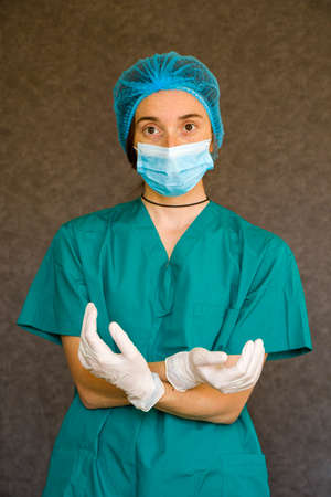 Woman doctors portrait, doctors with mask, glove and uniform. Uniform for surgery and viruses.の写真素材