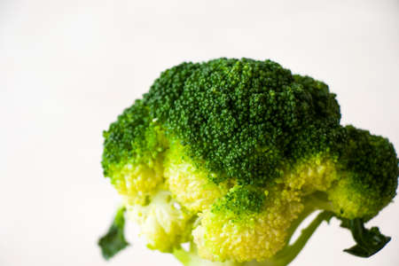 Broccoli vegetable macro and close-up on the white background, green color